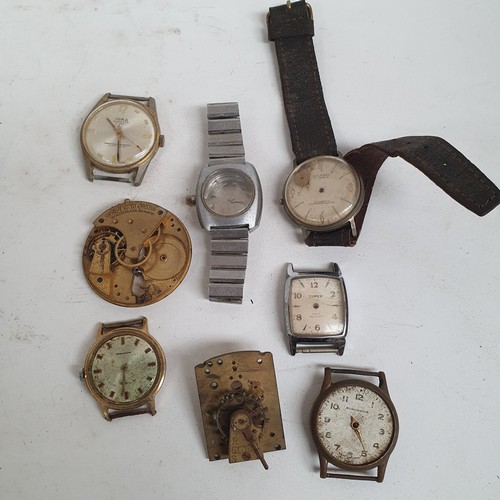 359 - A collection of watch faces and parts, clock movements etc