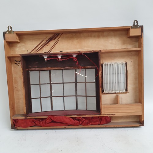 490 - A wall-hanging stained wood ornamental shop front, with glazed window and door panels 