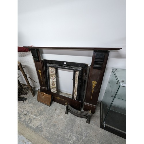 2641 - A Victorian cast iron fireplace with marble surround.