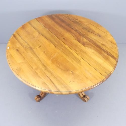 2737 - A French mahogany circular topped dining table, on turned central column with quadruple leg base. 12... 