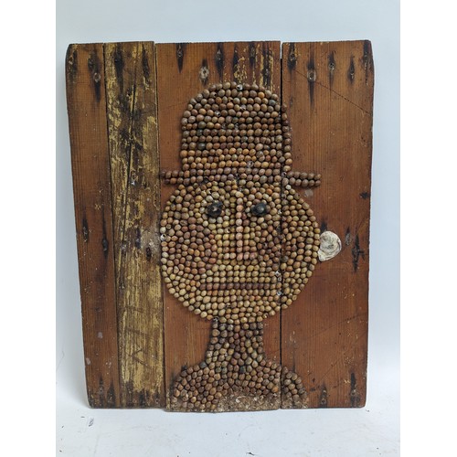 860 - A Folk Art handmade picture sculpture on board of a gentleman in a top hat, sculpture is made from s... 