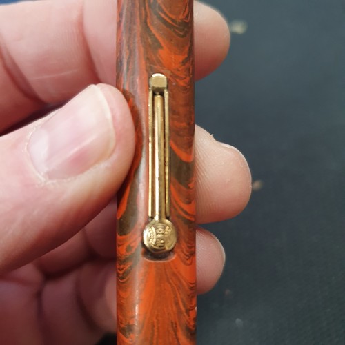 888 - A Watermans marble bodied fountain pen, with a 9ct gold band around the lid, nib is not gold, and a ... 