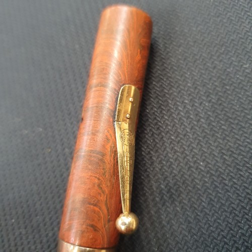 888 - A Watermans marble bodied fountain pen, with a 9ct gold band around the lid, nib is not gold, and a ... 