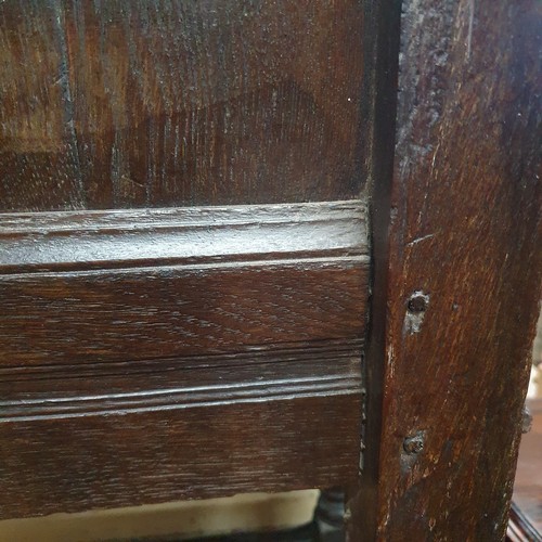 2188 - A late 18th / early 19th century joined oak Wainscot chair. Overall 66x112x53cm, seat 48x48x36cm.