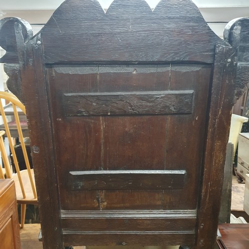 2188 - A late 18th / early 19th century joined oak Wainscot chair. Overall 66x112x53cm, seat 48x48x36cm.