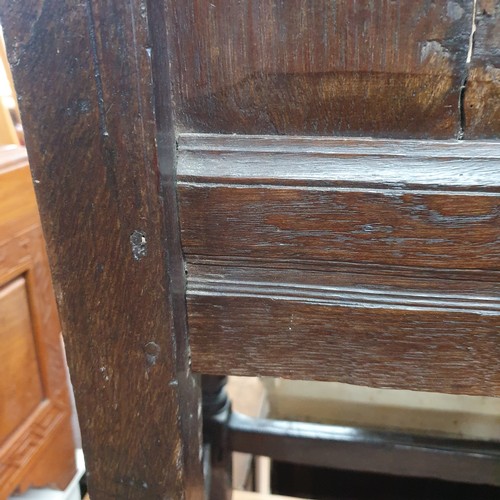 2188 - A late 18th / early 19th century joined oak Wainscot chair. Overall 66x112x53cm, seat 48x48x36cm.