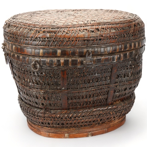 103 - An Indonesian hand-woven fishing basket with metal mounts, height 35cm