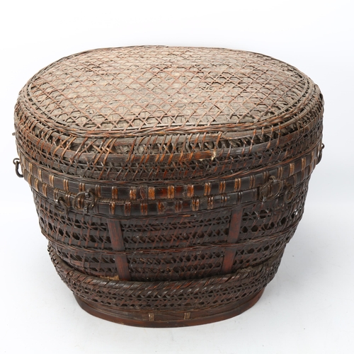 103 - An Indonesian hand-woven fishing basket with metal mounts, height 35cm