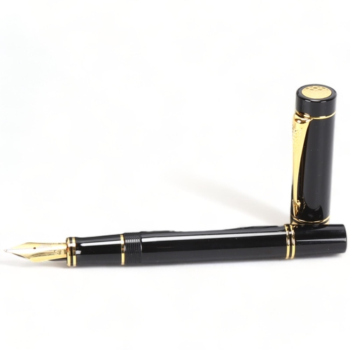 106 - A Parker Duofold Centennial fountain pen, with black lacquer and gilt metal body, 18ct gold (M) nib,... 