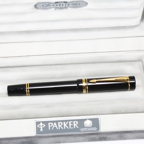 106 - A Parker Duofold Centennial fountain pen, with black lacquer and gilt metal body, 18ct gold (M) nib,... 