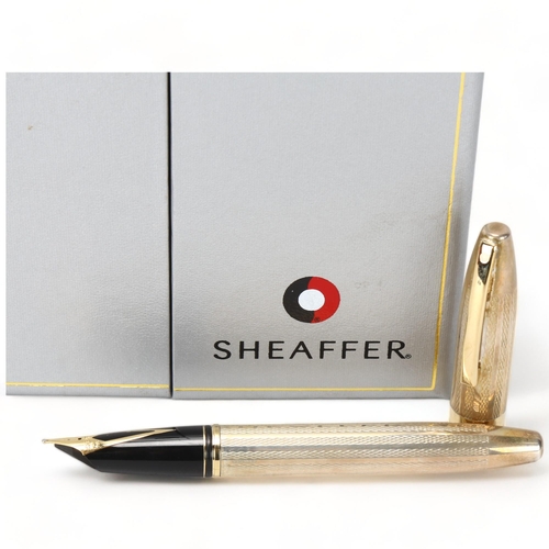 107 - A Sheaffer Legacy Heritage hallmarked sterling silver fountain pen, with 18ct gold nib and original ... 