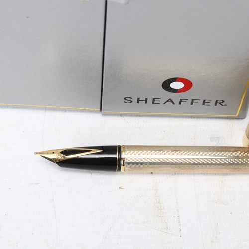 107 - A Sheaffer Legacy Heritage hallmarked sterling silver fountain pen, with 18ct gold nib and original ... 