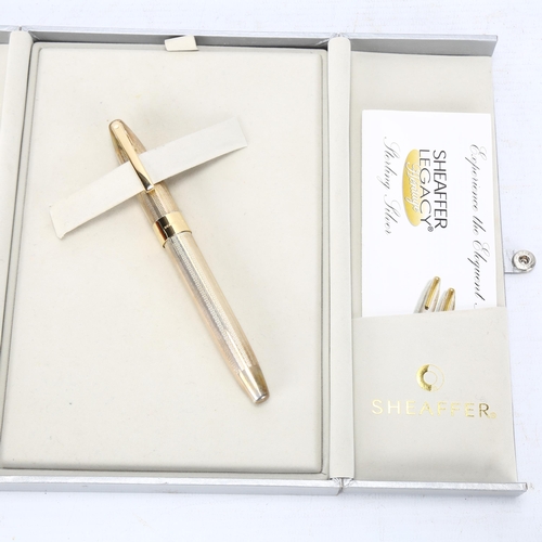 107 - A Sheaffer Legacy Heritage hallmarked sterling silver fountain pen, with 18ct gold nib and original ... 