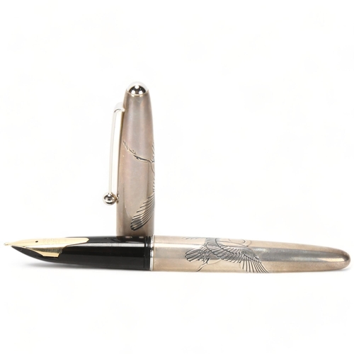 109 - A Pilot, Japan, fountain pen, with sterling silver cap and barrel, engraved with cranes, 14ct gold (... 