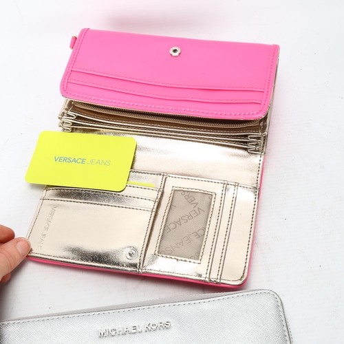 117 - Two designer purses - Michael Kors silvered leather purse and a Versace hot pink plastic purse with ... 