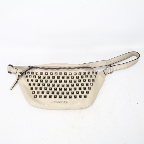 118 - A Michael Kors light-grey leather bum bag, with metal studded detail