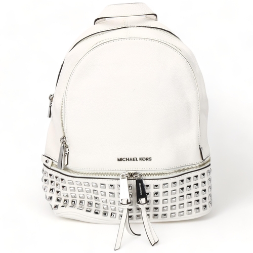 119 - A Michael Kors white leather back pack, with metal studded detail, tow main compartments and fitted ... 