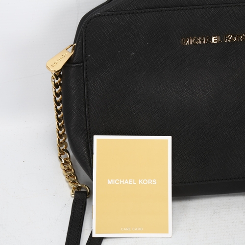 120 - A Michael Kors black leather cross-shoulder bag, with dust cover height 17cm, length 25cm