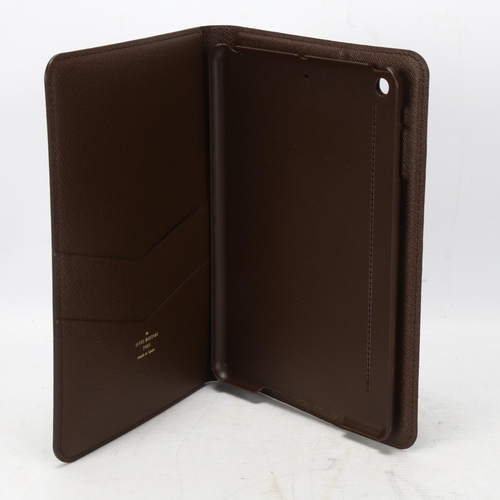 123 - **WITHDRAWN**A Louis Vuitton iPad cover, logo textile cover and leather lining, 3 card holder slots ... 