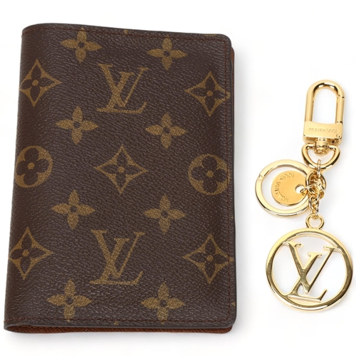 124 - **WITHDRAWN**A Louis Vuitton wallet, logo textile cover and leather lining, 3 card holder slots and ... 