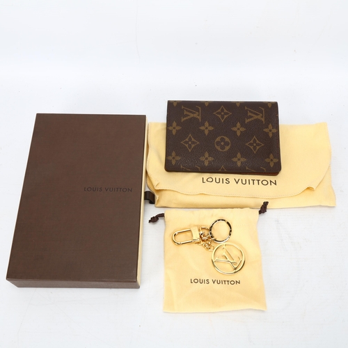 124 - **WITHDRAWN**A Louis Vuitton wallet, logo textile cover and leather lining, 3 card holder slots and ... 