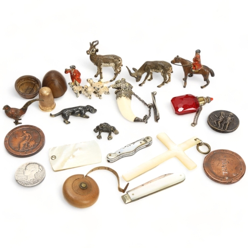 134 - A mixed group of items, including cold plated bronze animals, miniature pocket knives, coins, etc