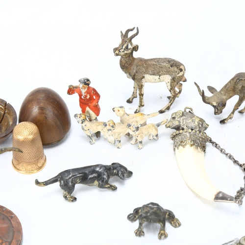 134 - A mixed group of items, including cold plated bronze animals, miniature pocket knives, coins, etc