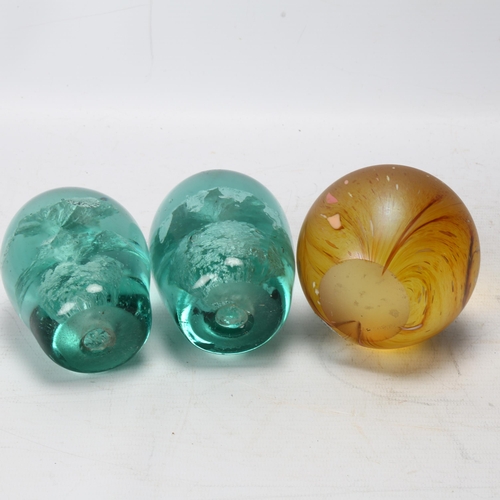 143 - 2 Victorian green glass dump weights, and an iridescent glass paperweight (3)