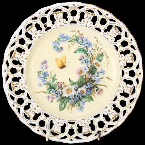 155 - A 19th century porcelain cabinet plate, with hand painted butterfly and flowers in pierced gilded bo... 