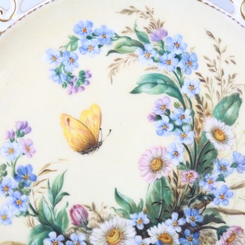 155 - A 19th century porcelain cabinet plate, with hand painted butterfly and flowers in pierced gilded bo... 