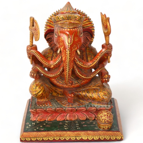 157 - An early 20th century figure of Ganesh, Indian elephant God wood carved and painted, height 15.5cm