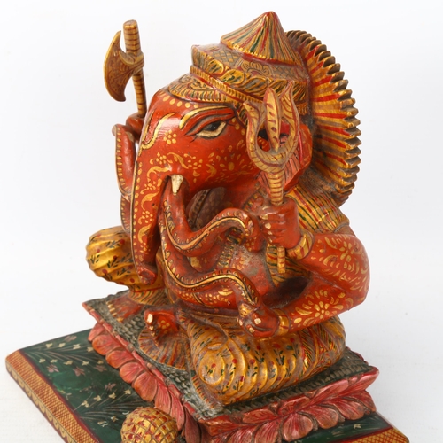 157 - An early 20th century figure of Ganesh, Indian elephant God wood carved and painted, height 15.5cm