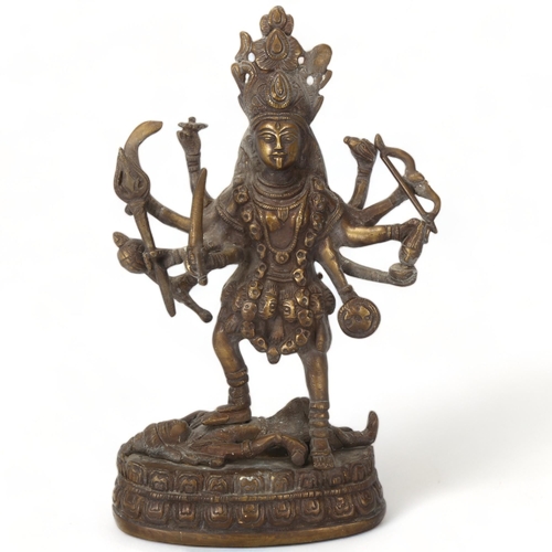 164 - A Indian bronze statue of Kali and Lord Shiva, height 23cm