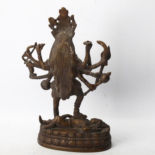 164 - A Indian bronze statue of Kali and Lord Shiva, height 23cm