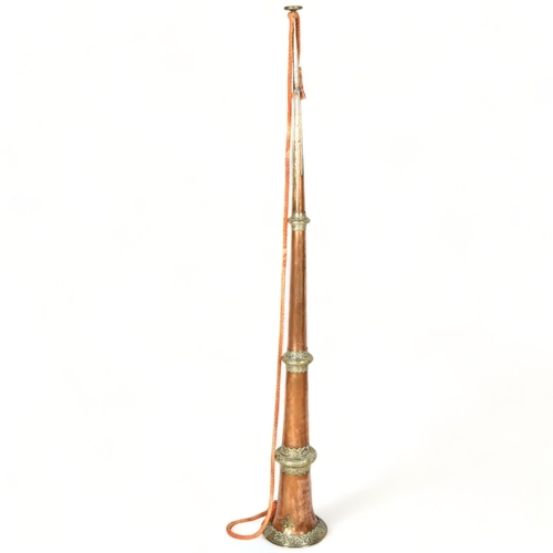 166 - A Tibetan temple horn, telescopic copper sections with brass mounts, extended length 140cm