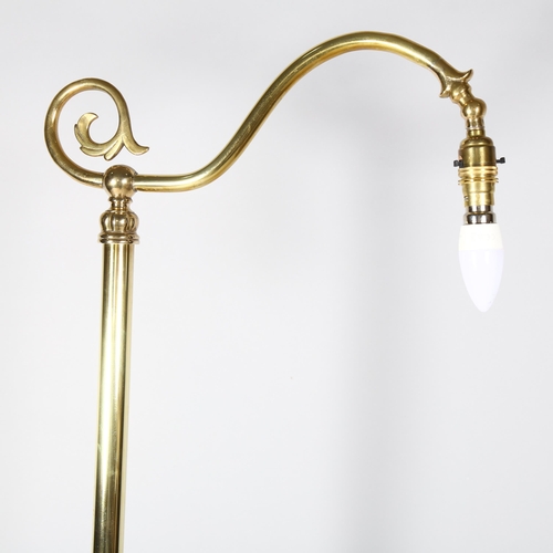 167 - A Victorian polished brass standard lamp, on cast platform base, height 170cm