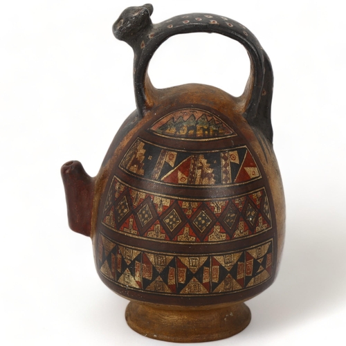 173 - A 16th century Peruvian terracotta ceremonial chicha pot, with puma handle and geometric painted pan... 