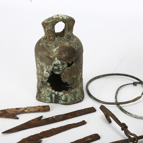 177 - A group of Bronze and other metal antiquities, including a bronze bell, bangles, arrowheads etc.