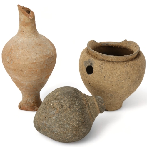 179 - Two pieces of ancient terracotta ceramics and a stone carved amphora shaped vessel, tallest 18cm