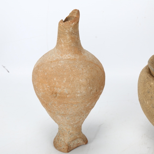 179 - Two pieces of ancient terracotta ceramics and a stone carved amphora shaped vessel, tallest 18cm