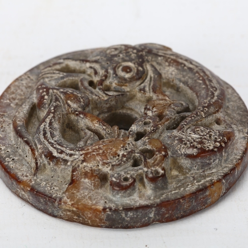 181 - A Chinese jade bi-disc with relief carved catfish design, diameter 5.5cm