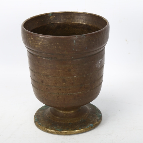 193 - A heavy bronze antique pestle and mortar, pestle length 23cm, mortar height 12cm