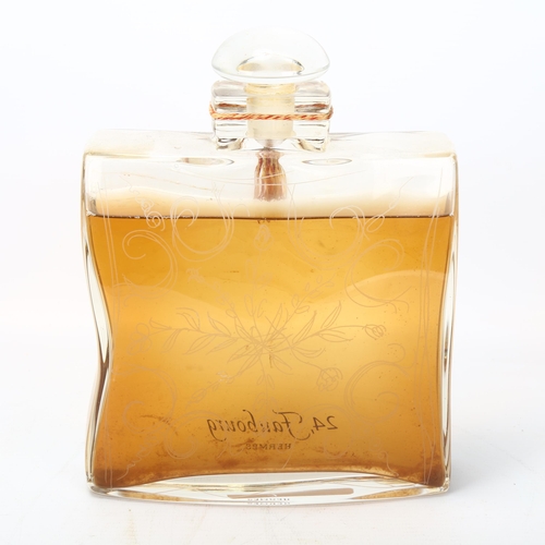 198 - A large Hermes glass display perfume bottle with etched front, height 21.5cm