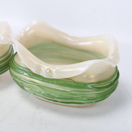 200 - A graduated pair of Loetz iridescent glass bowls, with trailed green glass decoration, largest lengt... 