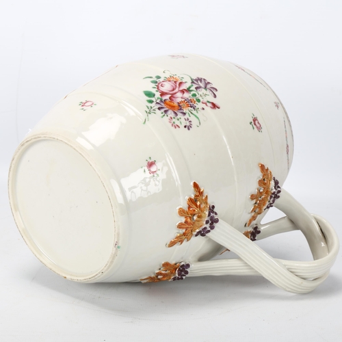 201 - A large Chinese export porcelain barrel-shaped jug, with cross over handles and gilded armorial cres... 