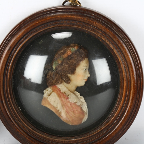 212 - A pair of coloured wax portraits of George III and Queen Charlotte, in mahogany frame with convex gl... 