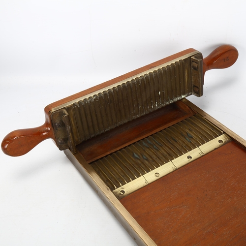 214 - A late 19th century mahogany and brass apothecary's pill making device, length 30cm