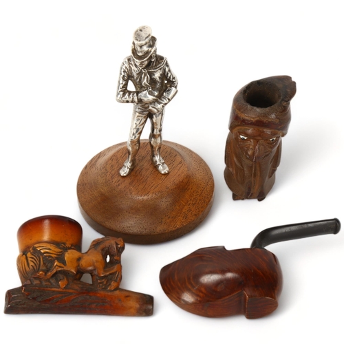 215 - A Victorian electroplate figure of a shoe shine man, height 11.5cm, and 3 novelty carved wood pipes ... 