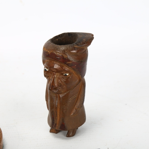 215 - A Victorian electroplate figure of a shoe shine man, height 11.5cm, and 3 novelty carved wood pipes ... 