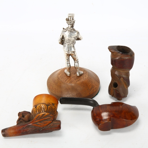 215 - A Victorian electroplate figure of a shoe shine man, height 11.5cm, and 3 novelty carved wood pipes ... 